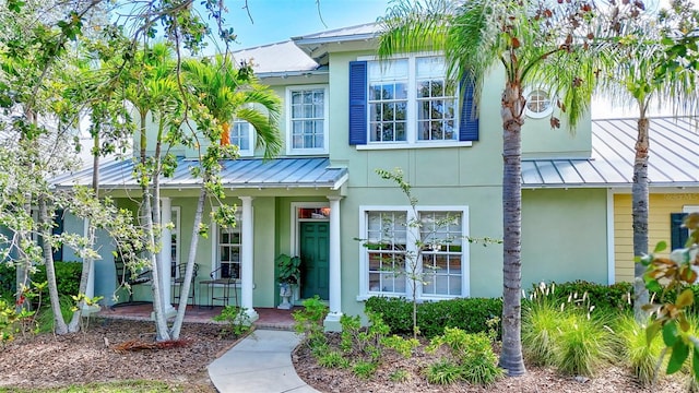 5518 Luminar Pointe Ln, Apollo Beach, FL 33572 - view of front of house with a standing seam roof and a metal roof