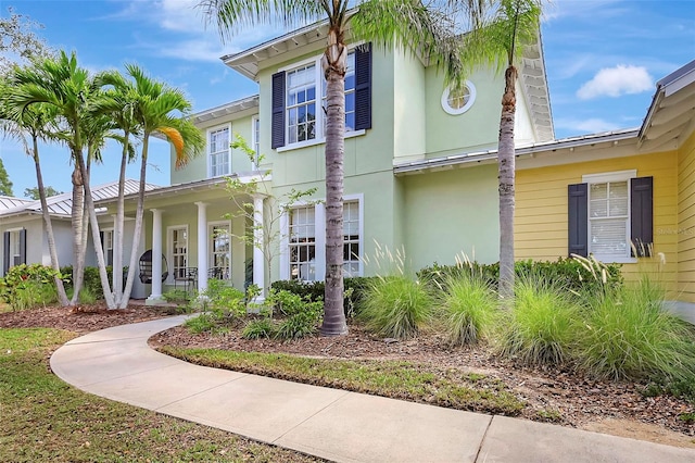 5518 Luminar Pointe Ln, Apollo Beach, FL 33572 - view of front of property with a porch and stucco siding
