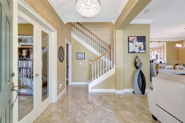 5518 Luminar Pointe Ln, Apollo Beach, FL 33572 - entrance foyer with a chandelier, ornamental molding, stairs, and french doors