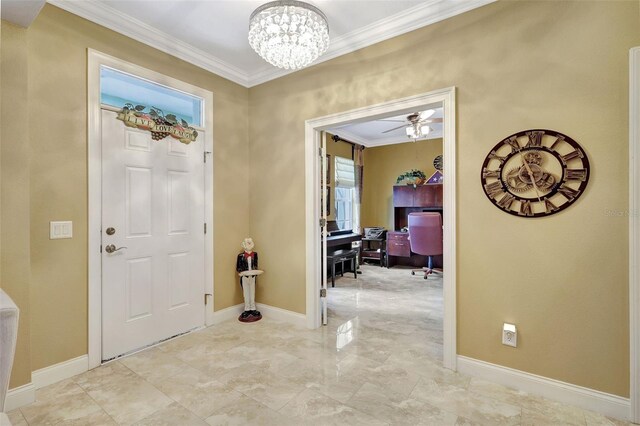 5518 Luminar Pointe Ln, Apollo Beach, FL 33572 - foyer featuring ornamental molding, a chandelier, light marble finish floors, and ceiling fan