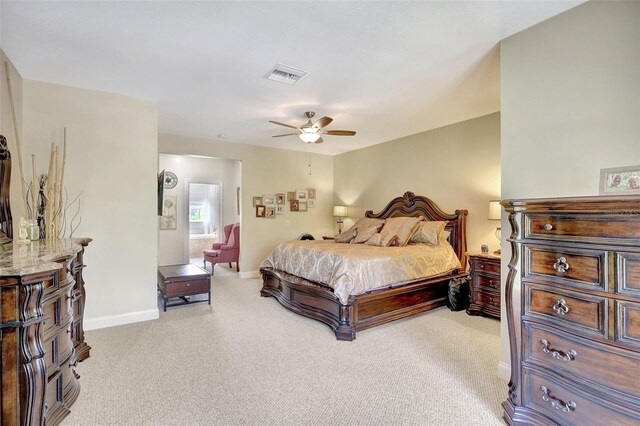 5518 Luminar Pointe Ln, Apollo Beach, FL 33572 - bedroom with light carpet, ensuite bathroom, and ceiling fan