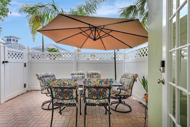 5518 Luminar Pointe Ln, Apollo Beach, FL 33572 - view of patio with outdoor dining space and a gate