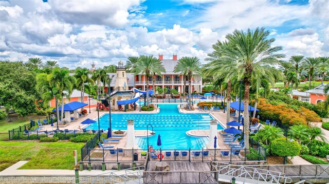 5518 Luminar Pointe Ln, Apollo Beach, FL 33572 - community pool with a water slide and a patio