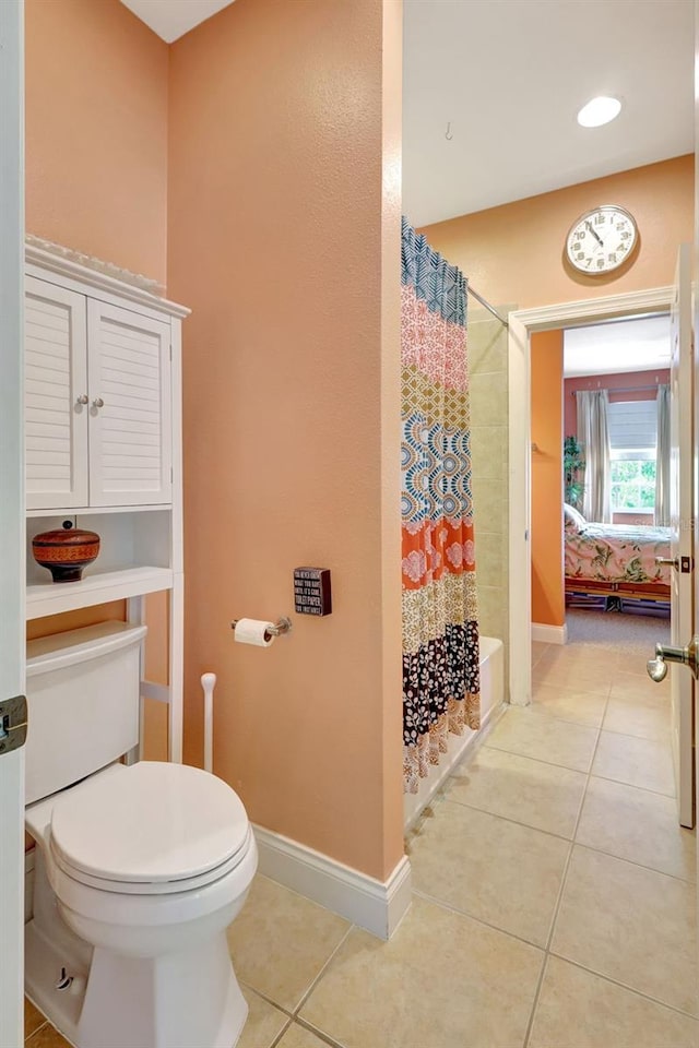 5518 Luminar Pointe Ln, Apollo Beach, FL 33572 - ensuite bathroom with tile patterned floors and shower / bath combo with shower curtain