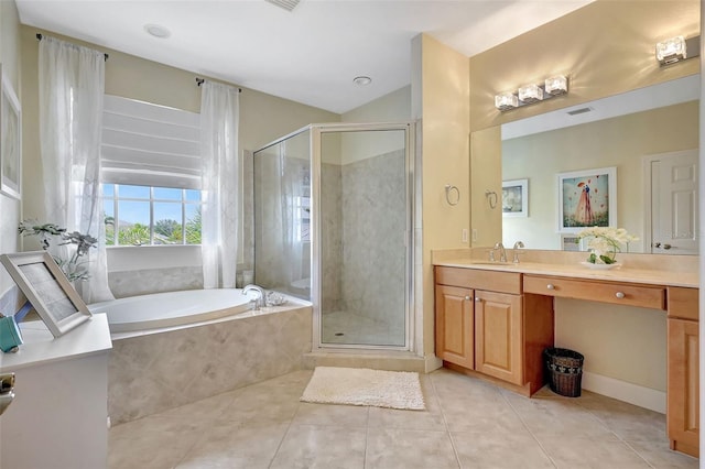 5518 Luminar Pointe Ln, Apollo Beach, FL 33572 - full bath with tile patterned floors, a bath, vanity, a stall shower, and vaulted ceiling