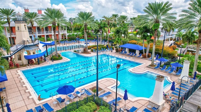 5518 Luminar Pointe Ln, Apollo Beach, FL 33572 - community pool featuring a water slide and a patio