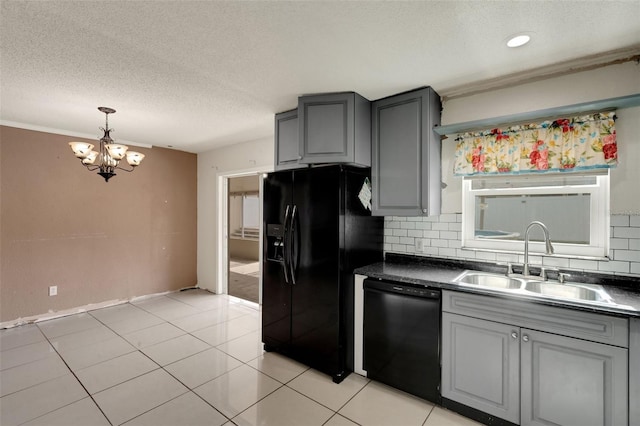 915 S Miller Rd, Valrico, FL 33594 - kitchen with black appliances, gray cabinetry, a textured ceiling, a chandelier, and dark countertops