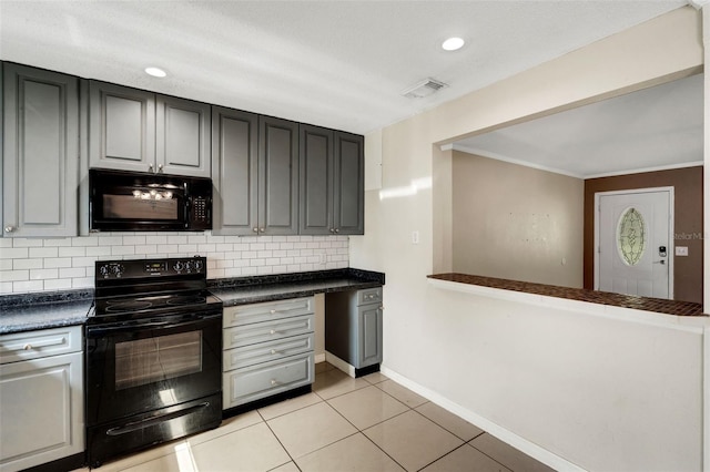 915 S Miller Rd, Valrico, FL 33594 - kitchen featuring black appliances, dark countertops, tasteful backsplash, light tile patterned floors, and ornamental molding