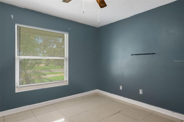 915 S Miller Rd, Valrico, FL 33594 - tiled empty room featuring ceiling fan and a textured ceiling