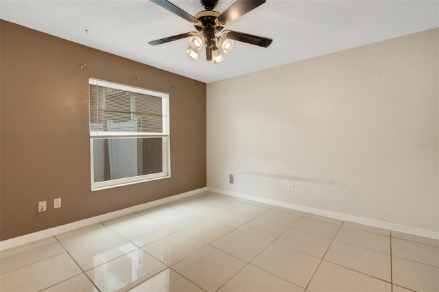 915 S Miller Rd, Valrico, FL 33594 - empty room featuring a ceiling fan and light tile patterned floors