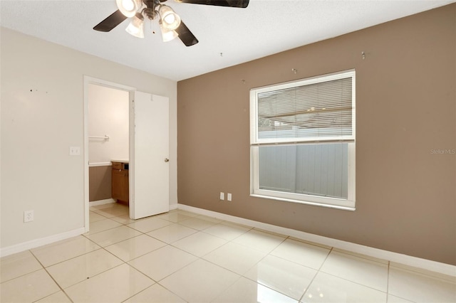 915 S Miller Rd, Valrico, FL 33594 - empty room featuring ceiling fan and light tile patterned floors