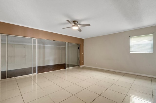915 S Miller Rd, Valrico, FL 33594 - unfurnished bedroom with light tile patterned floors, a closet, ornamental molding, and ceiling fan