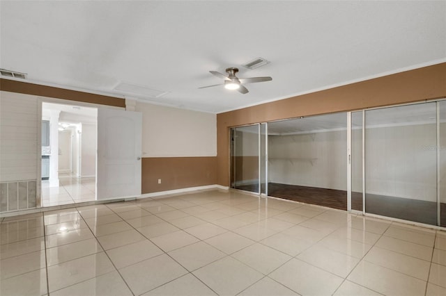 915 S Miller Rd, Valrico, FL 33594 - unfurnished bedroom featuring light tile patterned floors, a closet, ornamental molding, and a ceiling fan