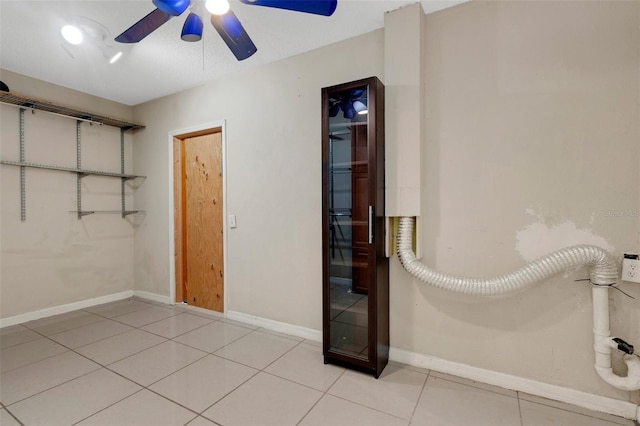 915 S Miller Rd, Valrico, FL 33594 - unfurnished bedroom featuring light tile patterned floors and a ceiling fan