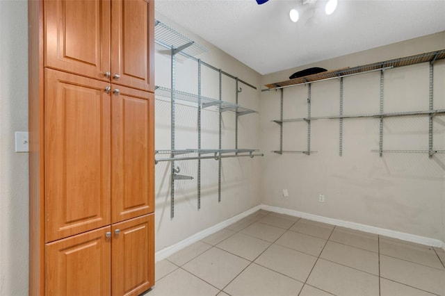 915 S Miller Rd, Valrico, FL 33594 - walk in closet with light tile patterned floors and a ceiling fan