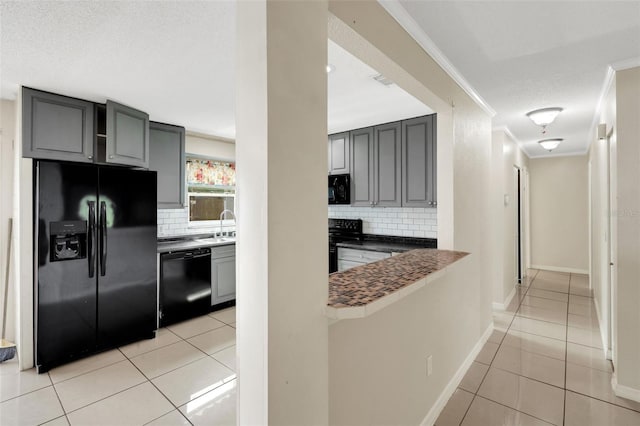 915 S Miller Rd, Valrico, FL 33594 - kitchen featuring black appliances, gray cabinetry, ornamental molding, tasteful backsplash, and light tile patterned floors