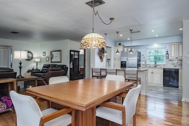 1510 Palmer Ct, Palm Harbor, FL 34685 - dining space with light wood finished floors and recessed lighting