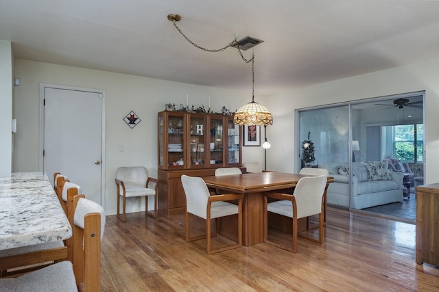 1510 Palmer Ct, Palm Harbor, FL 34685 - dining area with light wood finished floors and ceiling fan