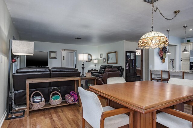 1510 Palmer Ct, Palm Harbor, FL 34685 - dining area featuring wood finished floors
