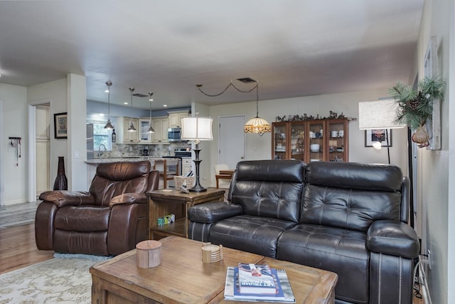 1510 Palmer Ct, Palm Harbor, FL 34685 - living room featuring light wood-style floors
