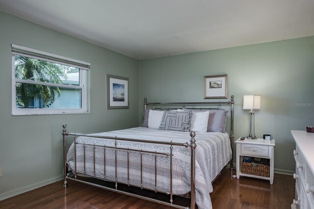 1510 Palmer Ct, Palm Harbor, FL 34685 - bedroom featuring wood finished floors and baseboards