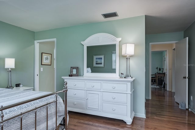 1510 Palmer Ct, Palm Harbor, FL 34685 - bedroom featuring dark wood-style flooring and baseboards