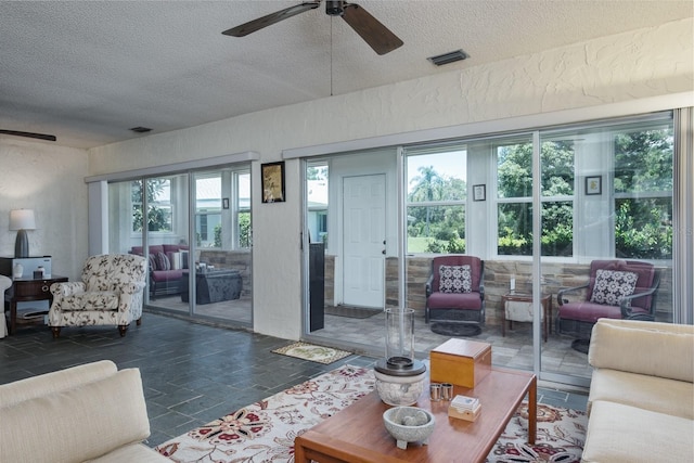 1510 Palmer Ct, Palm Harbor, FL 34685 - living area featuring a textured ceiling and ceiling fan