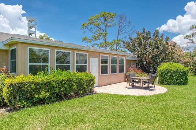1510 Palmer Ct, Palm Harbor, FL 34685 - rear view of property with a patio and a lawn