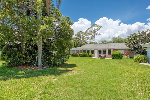 1510 Palmer Ct, Palm Harbor, FL 34685 - rear view of house with a lawn