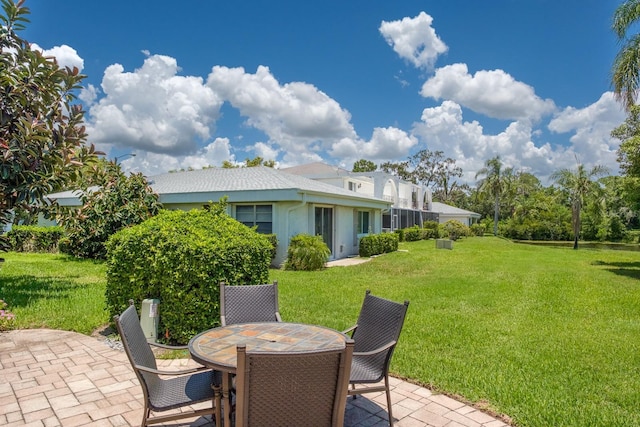 1510 Palmer Ct, Palm Harbor, FL 34685 - view of grassy yard featuring a patio