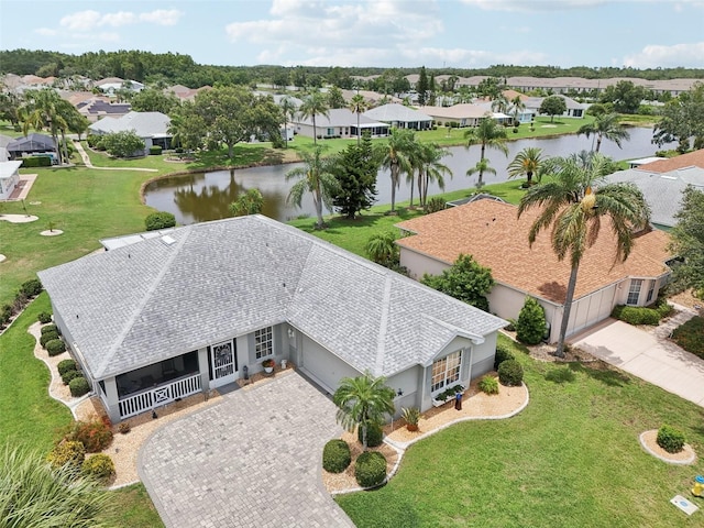 2306 Emerald Lake Dr, Sun City Center, FL 33573 - aerial perspective of suburban area with a large body of water