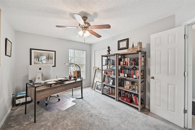2306 Emerald Lake Dr, Sun City Center, FL 33573 - carpeted office featuring a ceiling fan and a textured ceiling