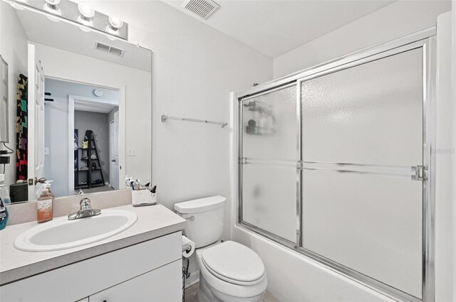 2306 Emerald Lake Dr, Sun City Center, FL 33573 - full bathroom with vanity and enclosed tub / shower combo