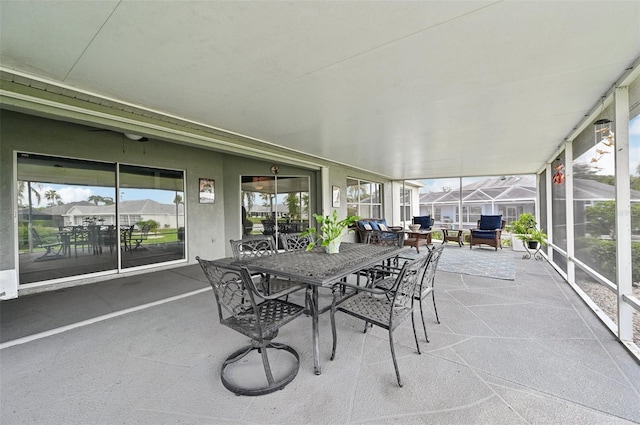 2306 Emerald Lake Dr, Sun City Center, FL 33573 - sunroom featuring outdoor dining area and plenty of natural light