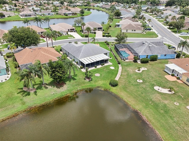 2306 Emerald Lake Dr, Sun City Center, FL 33573 - aerial perspective of suburban area with a large body of water
