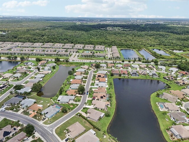 2306 Emerald Lake Dr, Sun City Center, FL 33573 - aerial view of property's location featuring nearby suburban area and a nearby body of water