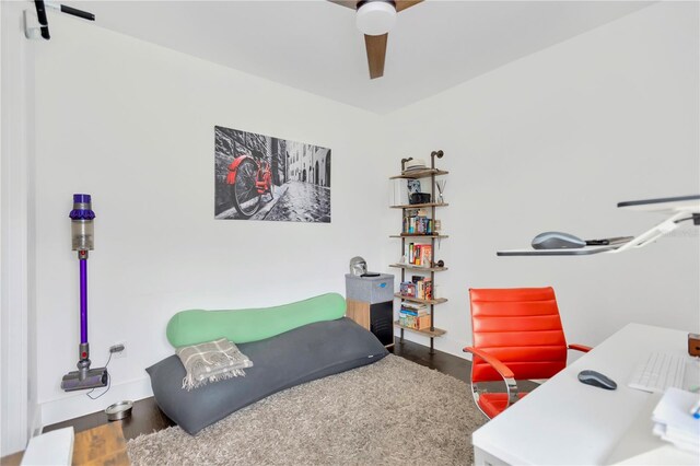 3100 W Paul Ave Unit 14, Tampa, FL 33611 - bedroom with an office area, a ceiling fan, and wood finished floors