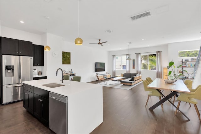 3100 W Paul Ave Unit 14, Tampa, FL 33611 - kitchen with stainless steel appliances, open floor plan, dark wood-style floors, light countertops, and recessed lighting
