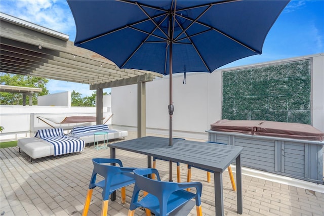 3100 W Paul Ave Unit 14, Tampa, FL 33611 - wooden terrace featuring a hot tub, a patio, and outdoor dining area