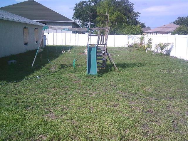 2429/2431 Quentin Ave S, Lehigh Acres, FL 33973 - view of yard featuring a playground