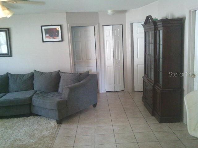 2429/2431 Quentin Ave S, Lehigh Acres, FL 33973 - living room featuring light tile patterned floors and ceiling fan
