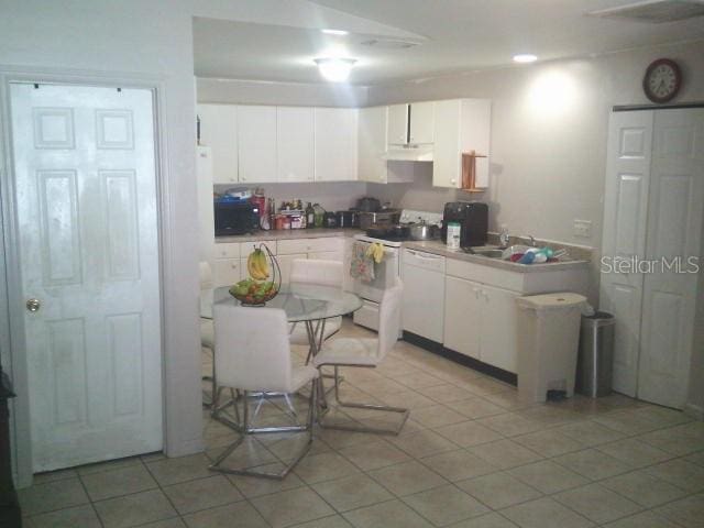 2429/2431 Quentin Ave S, Lehigh Acres, FL 33973 - kitchen featuring white appliances, white cabinets, and light tile patterned floors