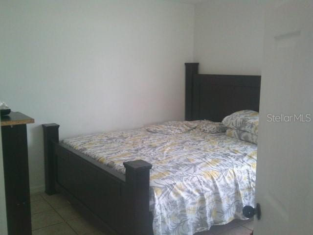 2429/2431 Quentin Ave S, Lehigh Acres, FL 33973 - bedroom with tile patterned flooring