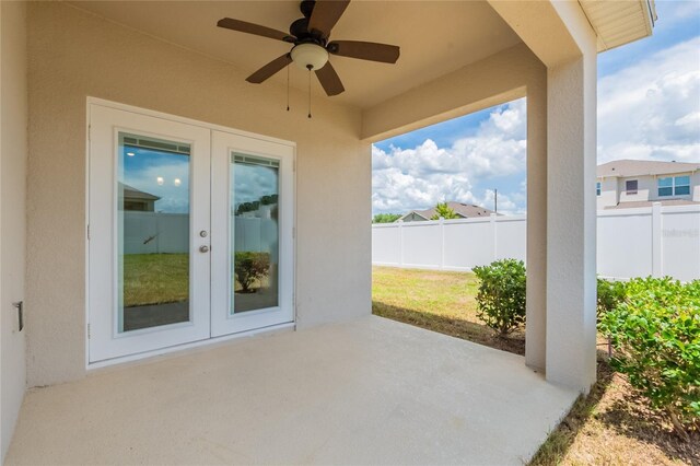 3079 Bethpage Loop, Mount Dora, FL 32757 - fenced backyard with french doors, a patio area, and ceiling fan