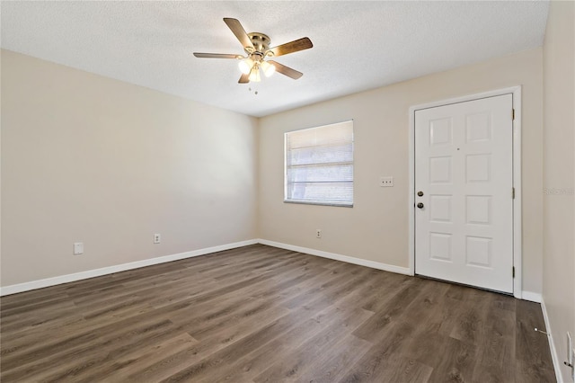 2901 Bay View Dr, Safety Harbor, FL 34695 - foyer featuring ceiling fan, wood finished floors, and a textured ceiling