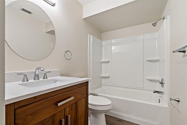 2901 Bay View Dr, Safety Harbor, FL 34695 - full bathroom featuring vanity, bathtub / shower combination, and wood finished floors