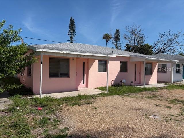 150 147th Ave E, Madeira Beach, FL 33708 - view of front of house with stucco siding