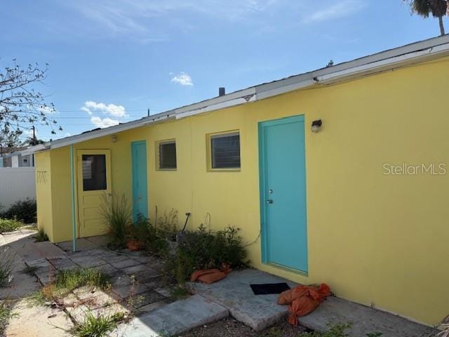 150 147th Ave E, Madeira Beach, FL 33708 - view of exterior entry with stucco siding