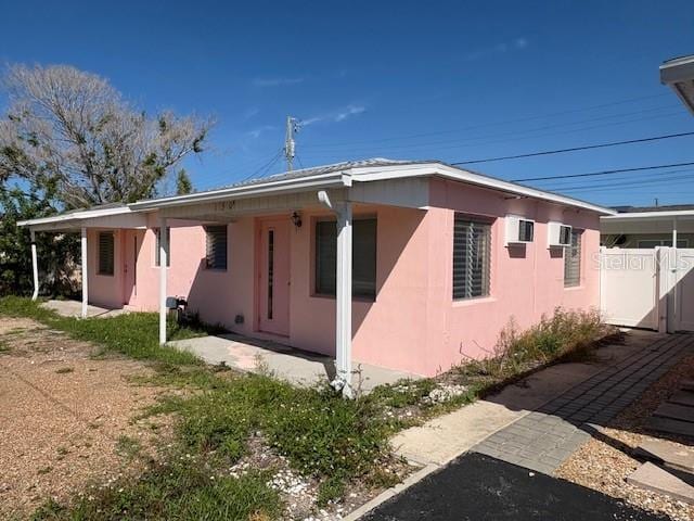 150 147th Ave E, Madeira Beach, FL 33708 - view of side of home featuring stucco siding