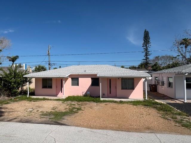150 147th Ave E, Madeira Beach, FL 33708 - rear view of house with stucco siding